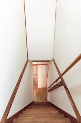 a staircase leading up to a door in a building at Hidden Valley in Tokyo
