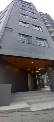 a building with a staircase leading up to a building at Wasabi Mita Hotel in Tokyo