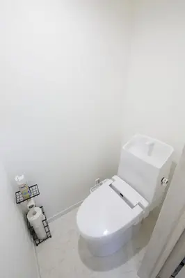 a bathroom with a white toilet in a room at Aries Nishi-Shinjuku 302 in Tokyo