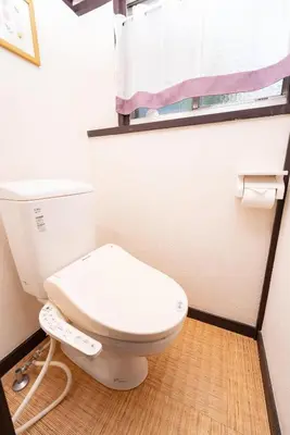 a white toilet in a bathroom with a window at 6BR 10Beds Direct to Shinjuku, Shibuya ,Tokyo Dome, Central ,Budget Friendly in Tokyo