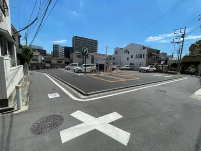 an empty street with cars parked in a parking lot at 6BR 10Beds Direct to Shinjuku, Shibuya ,Tokyo Dome, Central ,Budget Friendly in Tokyo