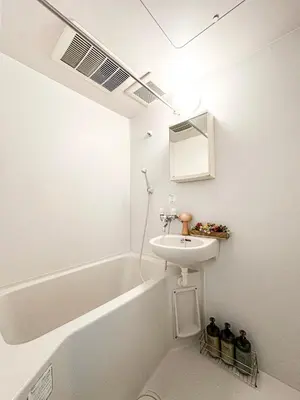 a white bathroom with a sink and a bath tub at nestay apartment tokyo itabashi in Tokyo