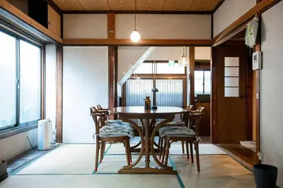 a dining room with a table and chairs at 【70平米 長期予約大歓迎】6LDK/日本家屋貸切/大人数で寛げる空間 in Tokyo