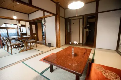 a living room with a table and a dining room at 【70平米 長期予約大歓迎】6LDK/日本家屋貸切/大人数で寛げる空間 in Tokyo