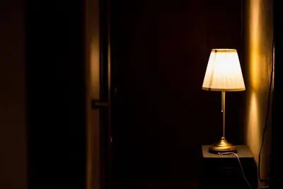 a lamp sitting on a table in a dark room at 【70平米 長期予約大歓迎】6LDK/日本家屋貸切/大人数で寛げる空間 in Tokyo