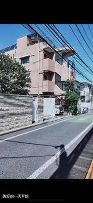 a shadow of a person walking down a street at 新宿の家-畳み3部屋 Maison à Shinjuku - pedalmi chambre 3 personnes in Tokyo