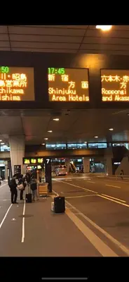 a group of people with their luggage at an airport at 新宿の家-畳み3部屋 Maison à Shinjuku - pedalmi chambre 3 personnes in Tokyo