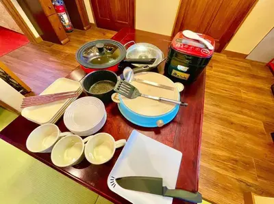 a table with plates and utensils on top of it at \u6728\u9999Mokkoh Modern Japanese style room by train15 minutes to Tokyo Station in Tokyo