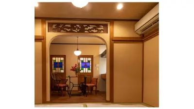 a hallway leading into a dining room with a table and chairs at \u6728\u9999Mokkoh Modern Japanese style room by train15 minutes to Tokyo Station in Tokyo