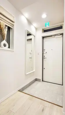 an empty room with a door and a mirror at Hotel STAY ARI Higashishinjuku in Tokyo
