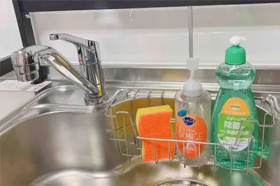 a sink with detergent and cleaning products in it at Oyama - Diamond Yu in Tokyo