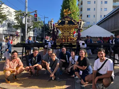 a group of people kneeling in front of a carousel at MAKOTO GUESTHOUSE -Limited Weight under 120kg, Age under 50years old- in Tokyo