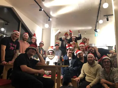 a group of people wearing christmas hats posing for a picture at MAKOTO GUESTHOUSE -Limited Weight under 120kg, Age under 50years old- in Tokyo