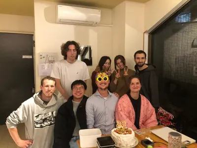 a group of people are posing for a picture at MAKOTO GUESTHOUSE -Limited Weight under 120kg, Age under 50years old- in Tokyo