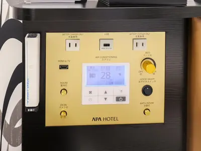 a machine with a clock on top of it at APA Hotel Kayabacho Hachobori Ekimae in Tokyo