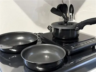 two pots and pans sitting on top of a stove at Five room 120 SKY TREE SENSOJI FreeParking 1292sqft in Tokyo