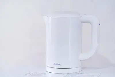 a white jug sitting on top of a table at 10min walk to Shinjuku EoS9 in Tokyo
