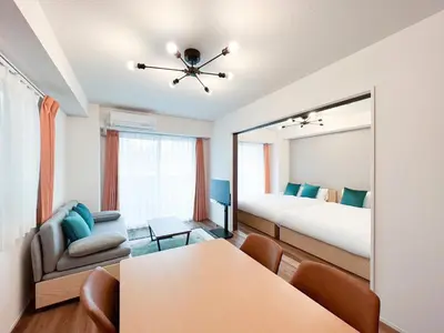 a room with a bedroom with a bed and a mirror at aLATO\u9326\u7cf8\u753a in Tokyo