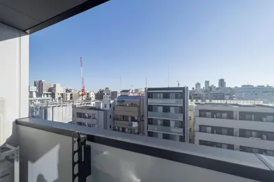 a view of a city skyline from a balcony at aLATO\u9326\u7cf8\u753a in Tokyo
