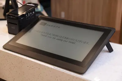 a tablet computer sitting on top of a counter at Washington R&B Hotel Otsuka Eki Kitaguchi in Tokyo