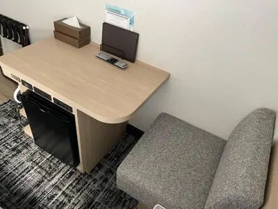 a desk with a computer and two chairs in a room at WASHINGTON R&B Hotel Ueno Hirokoji in Tokyo
