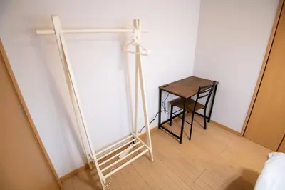 a room with a wooden cross and a table at Rea\u65b0\u5c0f\u5ca92\u4e01\u76ee403 in Tokyo