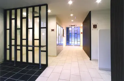 a hallway with a door in a building at Washington R&BHotel TokyoToyocho in Tokyo