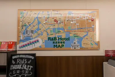 a map hanging on the wall of a building at Washington R&BHotel TokyoToyocho in Tokyo