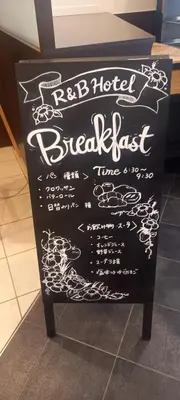 a chalkboard sign with abidbidbidlished breakfast time at WashingtonR&B Hotel Kamata Higashiguchi in Tokyo