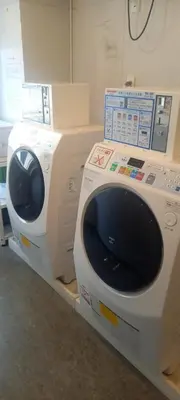 a washing machine sitting on a shelf in a room at WashingtonR&B Hotel Kamata Higashiguchi in Tokyo