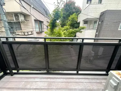 a balcony with a view of a building at Tokyo Shinjuku hotel in Tokyo