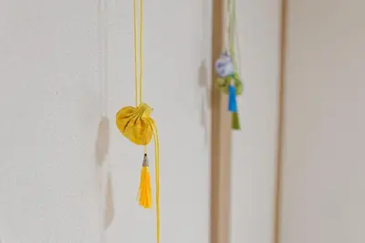 a yellow teddy bear hanging on a wall at Tokyo Shinjuku hotel in Tokyo