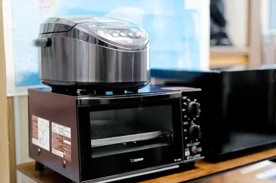 a toaster oven sitting on top of a microwave at Tokyo Shinjuku hotel in Tokyo