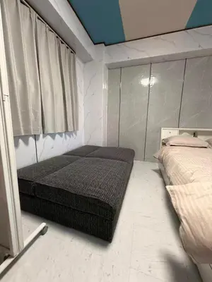 a bedroom with two beds and a window at \u548c\u98a8\u5ba2\u68e7 in Tokyo