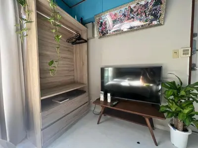a living room with a flat screen tv and a table at \u548c\u98a8\u5ba2\u68e7 in Tokyo