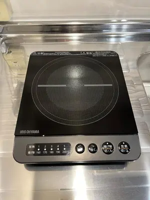 a tablet computer sitting on top of an oven at Cozy inn Oyama in Tokyo