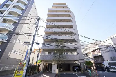 a tall building in front of a street at \u65e7 DeLCCS\u5c71\u5439\u795e\u697d\u5742III in Tokyo
