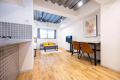 a living room with a table and chairs and a couch at Gran Fusion\u6c60\u888b in Tokyo
