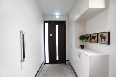 a hallway with a door leading to a room with white walls at ks\u897f\u65e9\u7a32\u7530 in Tokyo