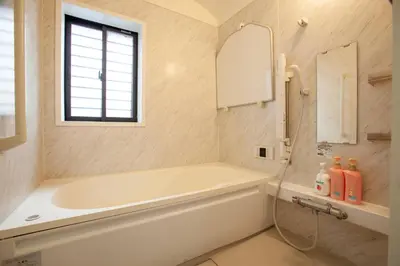 a bathroom with a tub and a sink and a mirror at ks\u897f\u65e9\u7a32\u7530 in Tokyo