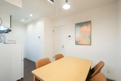a kitchen and dining room with a table and chairs at Livecasa\u4e21\u56fd I in Tokyo