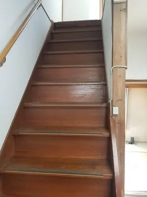 a set of stairs in a house with wooden at Little Bird Takinogawa #1 in Tokyo