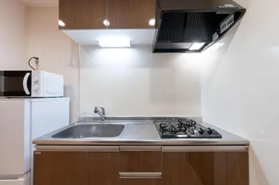 a kitchen with a sink and a microwave at KiSETSU\u795e\u697d\u5742 in Tokyo