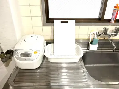 a white mixer sitting on top of a kitchen sink at Hotel KinRin in Tokyo
