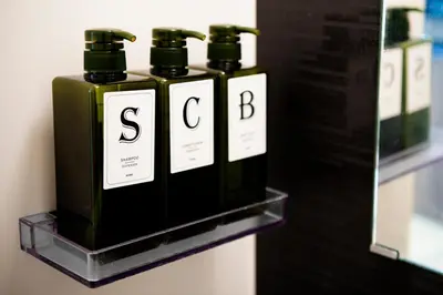 a row of bottles of soap on a shelf at #9 3mins to station 1stop to Shinjuku Stylish apartment with plenty of sunlight in Tokyo