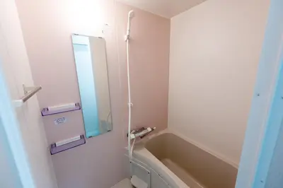 a bathroom with a tub and a sink and a mirror at \u4eca\u548cHotel in Tokyo