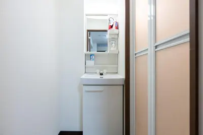 a bathroom with a sink and a mirror at \u4eca\u548cHotel in Tokyo