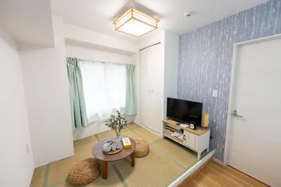 a living room with a tv and a table at \u4eca\u548cHotel in Tokyo