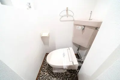 a bathroom with a white toilet and a sink at Shibuya E Address 303 in Tokyo