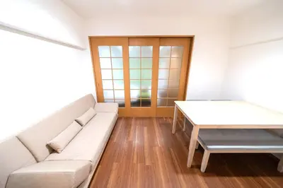 a living room with a white couch and a table at Shibuya E Address 303 in Tokyo